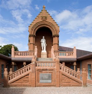 A tall white statue of Robert Burns at the Burns Monument Centre