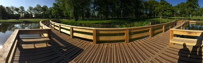 A boardwalk across a pond