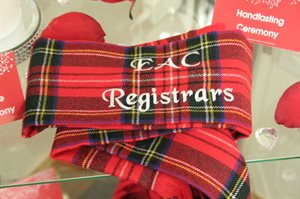 Red tartan scarf which can be used in handfasting