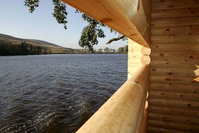 Wooden wildlife hide looking across Glenbuck Loch - the start of the River Ayr Way