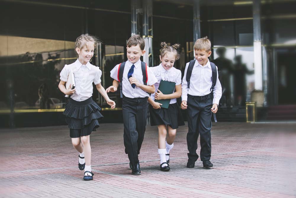 Young children wearing a school uniform at school