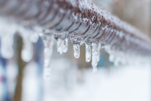 Pipe with frozen ice and icicles