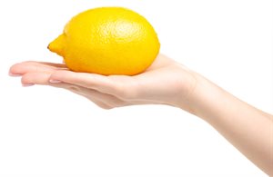 Hand holding lemon