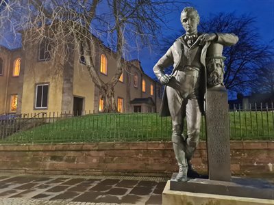 Statue of Johnnie Walker and the New Laigh Kirk Church in the background