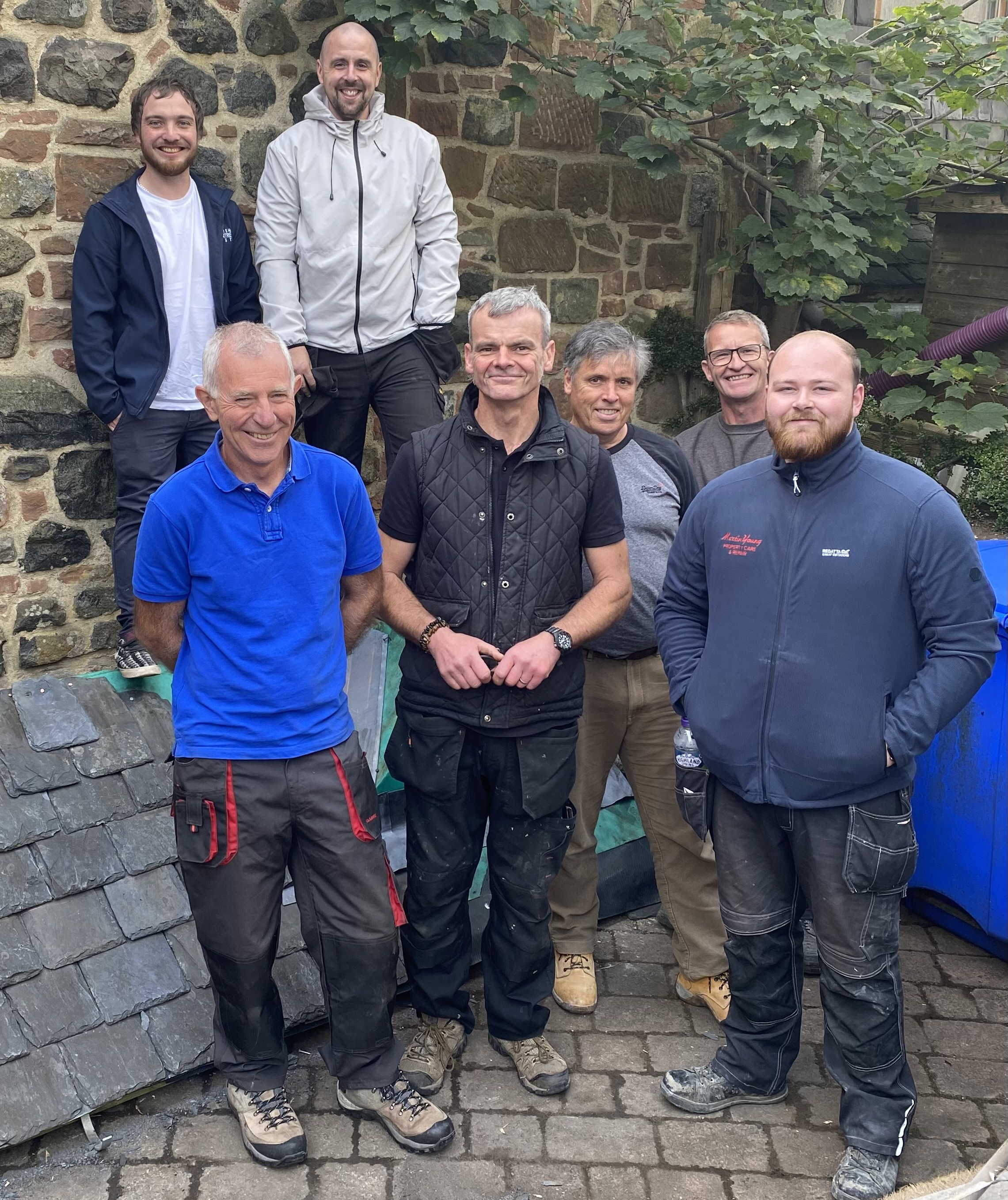 Group of people learning about Scottish slate roofing