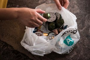 White recycling bag filled with aluminium coffee pods