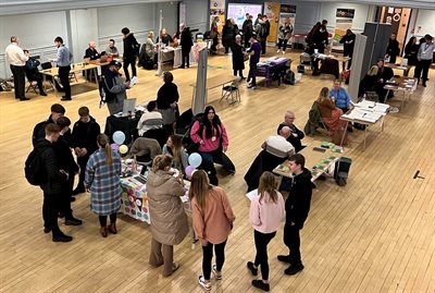 People walking around and chatting at a recruitment event in the Grand Hall, Kilmarnock