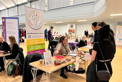 People walking around and chatting at a recruitment event in the Grand Hall, Kilmarnock