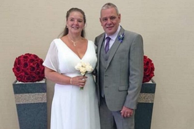 Bride and groom smiling at the Burns Monument Centre