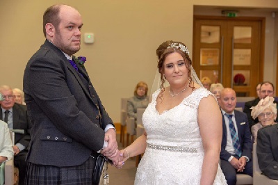 Bride and groom holding hands