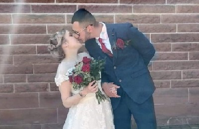 Bride and groom kissing